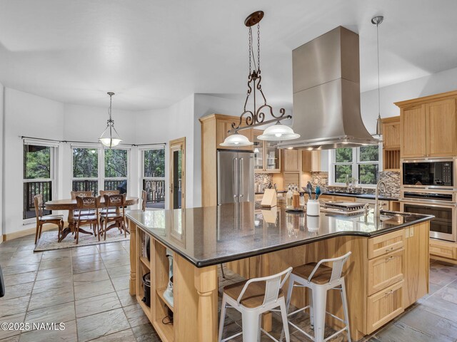 284 E Foothill Trl, Williams, AZ 86046 - kitchen with backsplash, island range hood, open shelves, a large island with sink, and stainless steel appliances