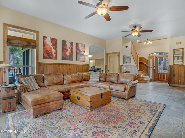 284 E Foothill Trl, Williams, AZ 86046 - living room with stairway, a wainscoted wall, ceiling fan, and arched walkways