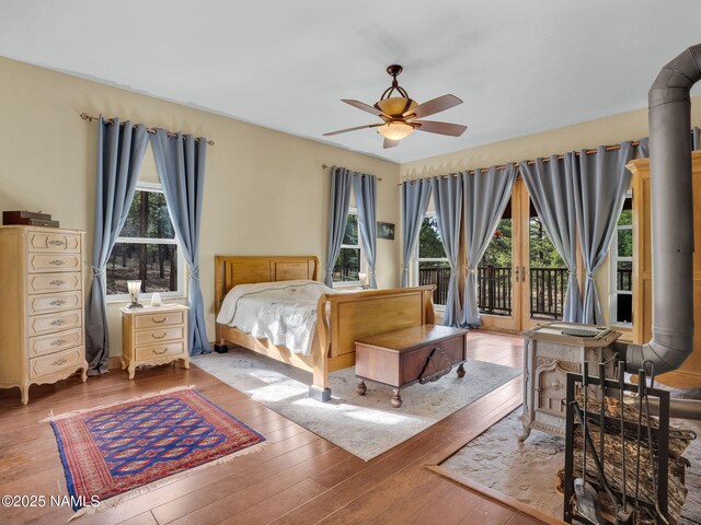284 E Foothill Trl, Williams, AZ 86046 - bedroom with ceiling fan, wood-type flooring, and access to exterior