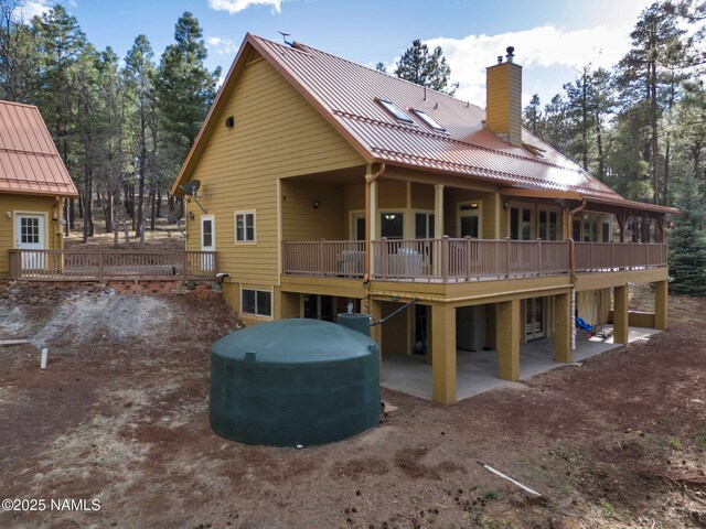 284 E Foothill Trl, Williams, AZ 86046 - rear view of property with a patio, a chimney, and a deck