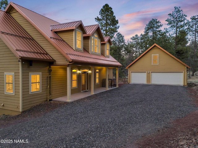 284 E Foothill Trl, Williams, AZ 86046 - rustic home with a porch, a standing seam roof, metal roof, a detached garage, and an outdoor structure