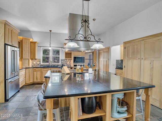 284 E Foothill Trl, Williams, AZ 86046 - kitchen featuring a kitchen breakfast bar, tasteful backsplash, open shelves, high end refrigerator, and light brown cabinets
