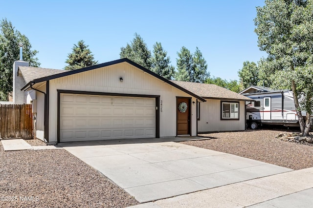 3425 W Mountain Dr, Flagstaff, AZ 86001 - ranch-style home featuring driveway, an attached garage, and roof with shingles