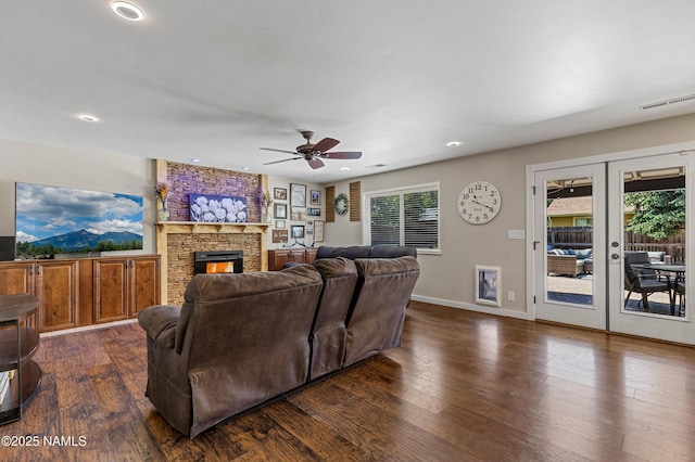 3425 W Mountain Dr, Flagstaff, AZ 86001 - living area with dark wood-type flooring, french doors, recessed lighting, a ceiling fan, and a stone fireplace