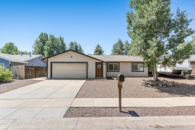 3425 W Mountain Dr, Flagstaff, AZ 86001 - single story home featuring concrete driveway and an attached garage