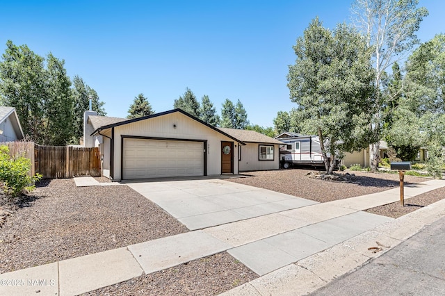 3425 W Mountain Dr, Flagstaff, AZ 86001 - ranch-style house with concrete driveway and a garage