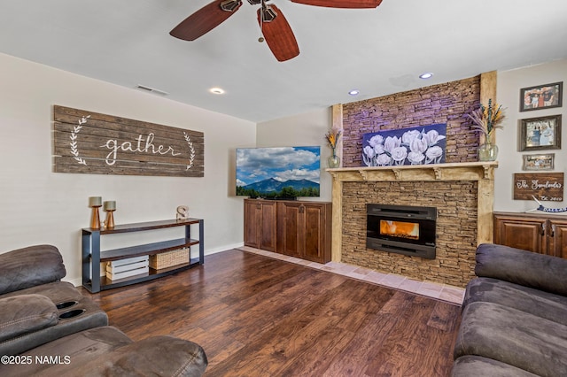 3425 W Mountain Dr, Flagstaff, AZ 86001 - living room with a ceiling fan, wood finished floors, and a stone fireplace