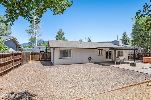 3425 W Mountain Dr, Flagstaff, AZ 86001 - back of house featuring a patio, a fenced backyard, and french doors