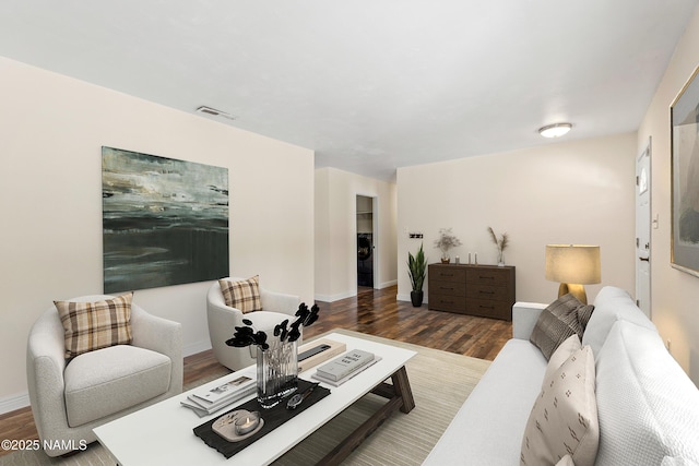 1536 N Foxglenn St, Flagstaff, AZ 86004 - living room featuring wood finished floors, visible vents, and baseboards