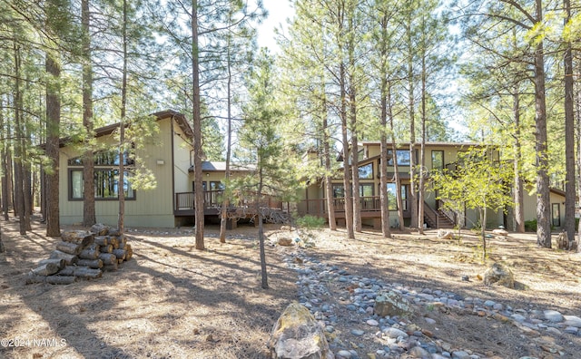 view of yard featuring a playground and a deck