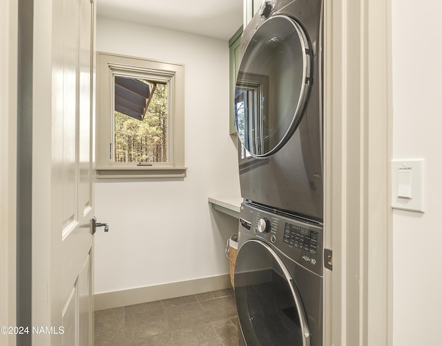 laundry room featuring stacked washer and dryer