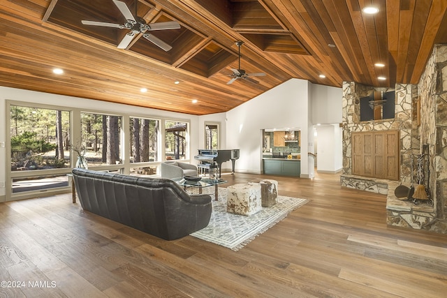 living room featuring wood ceiling, hardwood / wood-style flooring, and a healthy amount of sunlight