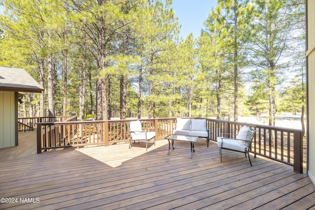 wooden deck featuring outdoor lounge area