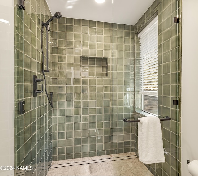 bathroom featuring walk in shower and tile patterned floors