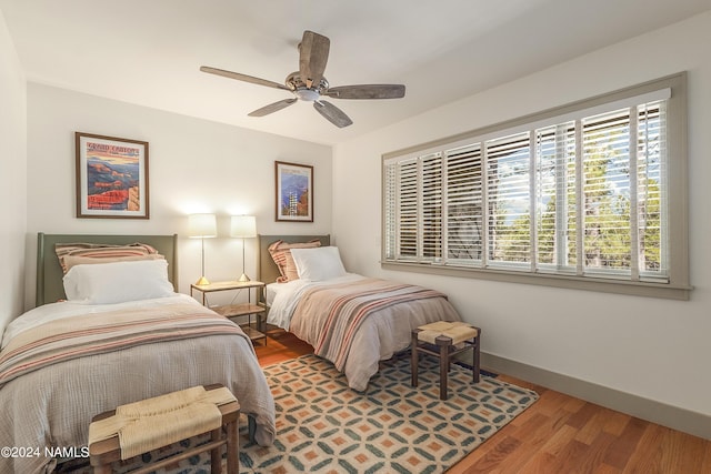 bedroom featuring hardwood / wood-style flooring and ceiling fan