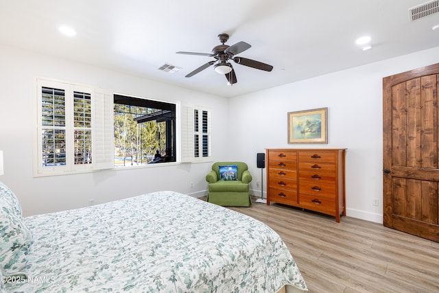 bedroom with ceiling fan and light hardwood / wood-style floors