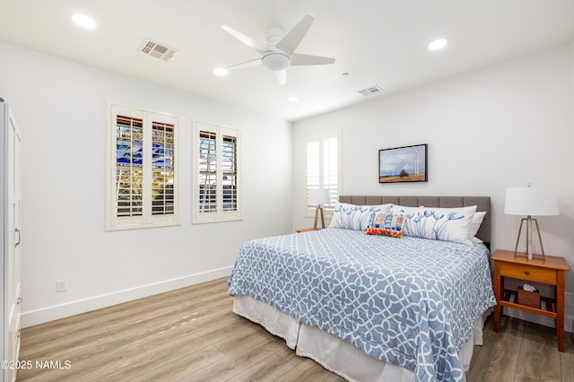 bedroom featuring hardwood / wood-style floors and ceiling fan