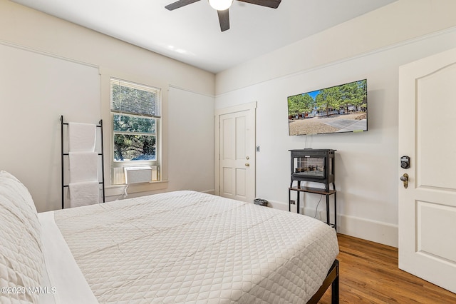 3380 E Lockett Rd, Flagstaff, AZ 86004 - bedroom with wood finished floors, ceiling fan, and cooling unit