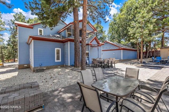 3380 E Lockett Rd, Flagstaff, AZ 86004 - back of house with outdoor dining area, a patio area, and crawl space