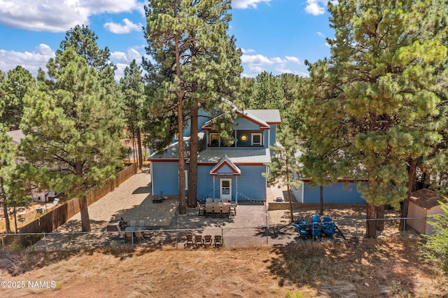 3380 E Lockett Rd, Flagstaff, AZ 86004 - view of front of house with a fenced backyard and a patio area
