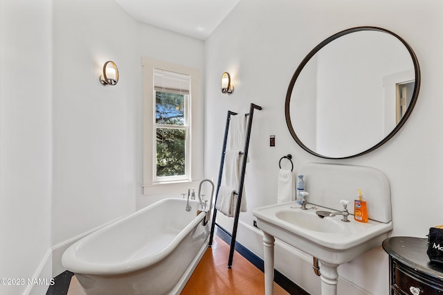 3380 E Lockett Rd, Flagstaff, AZ 86004 - full bathroom featuring a freestanding bath and baseboards
