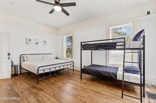 3380 E Lockett Rd, Flagstaff, AZ 86004 - bedroom with multiple windows, light wood-style flooring, and ceiling fan