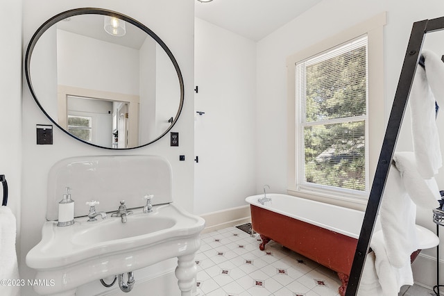 3380 E Lockett Rd, Flagstaff, AZ 86004 - bathroom featuring baseboards, a freestanding tub, and tile patterned flooring
