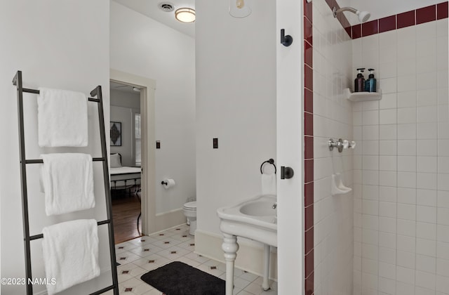 3380 E Lockett Rd, Flagstaff, AZ 86004 - bathroom with tiled shower, toilet, and tile patterned floors