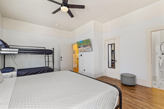 3380 E Lockett Rd, Flagstaff, AZ 86004 - bedroom featuring wood finished floors, baseboards, and a ceiling fan