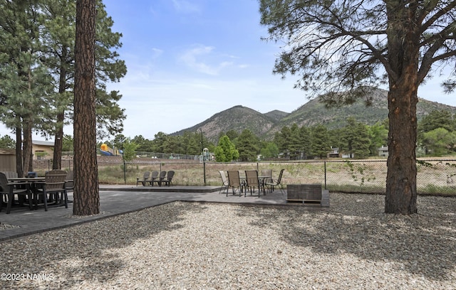 3380 E Lockett Rd, Flagstaff, AZ 86004 - view of yard with a mountain view, a patio, and outdoor dining area