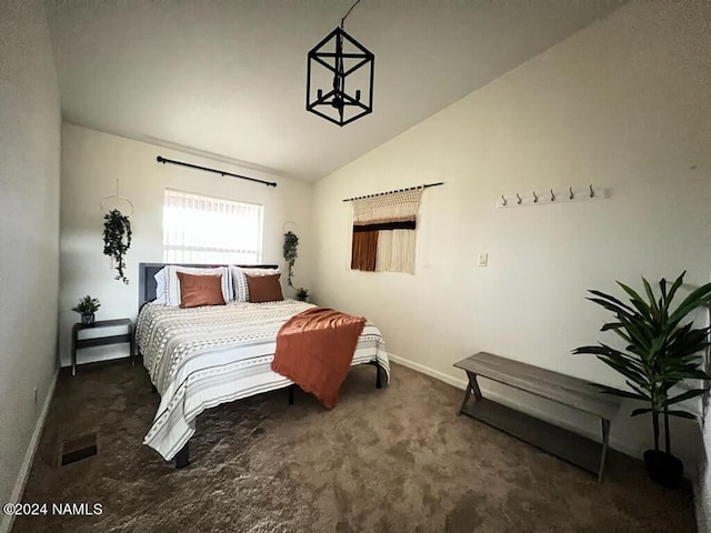 bedroom featuring carpet floors, visible vents, baseboards, and vaulted ceiling