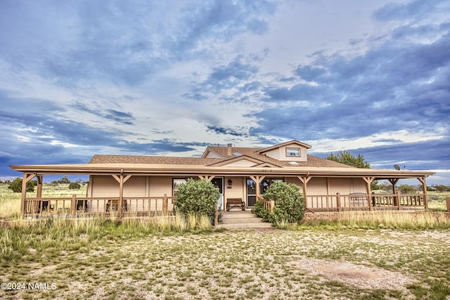 farmhouse-style home with covered porch