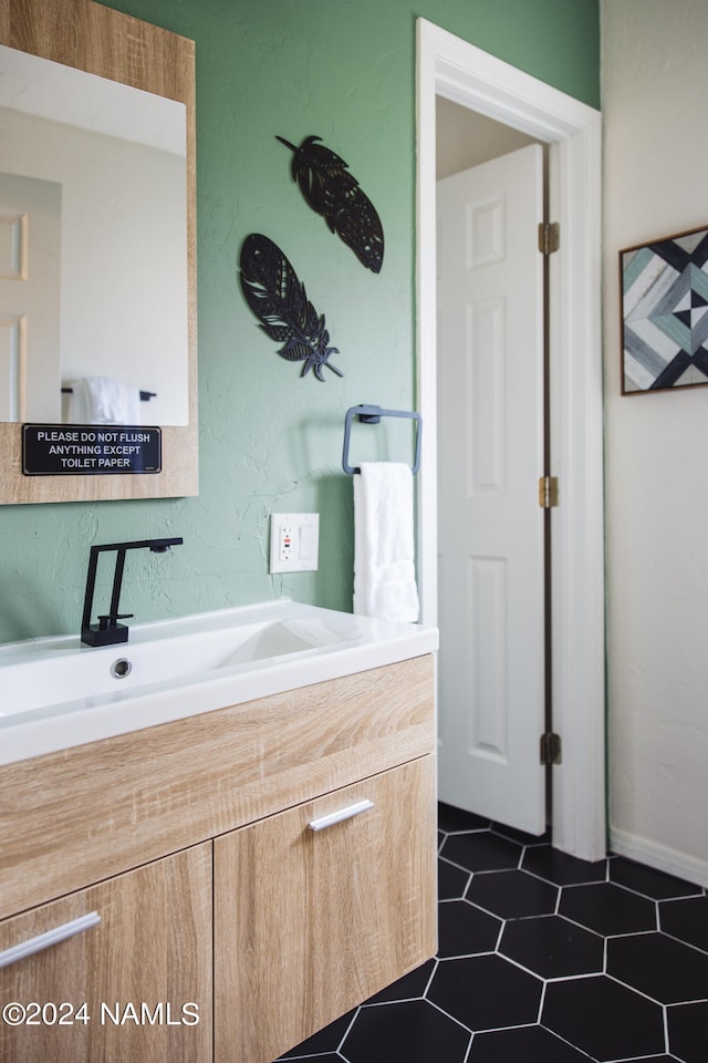 bathroom with vanity and tile patterned floors