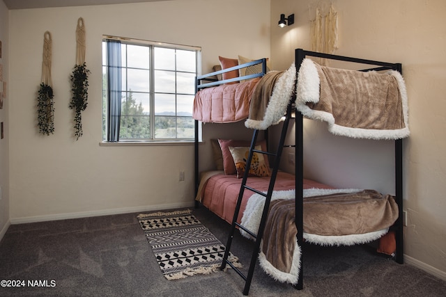 carpeted bedroom with baseboards