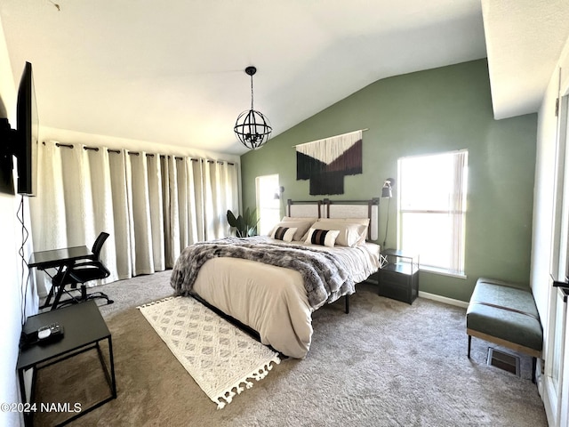 carpeted bedroom with a notable chandelier, vaulted ceiling, visible vents, and baseboards