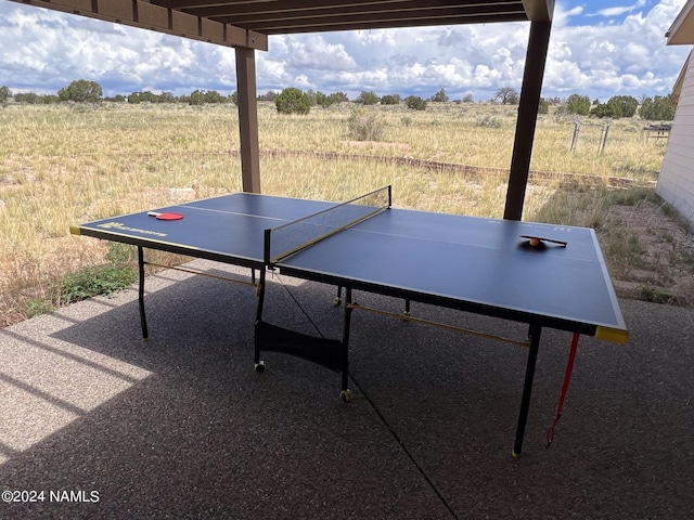 exterior space with outdoor dining area and a rural view