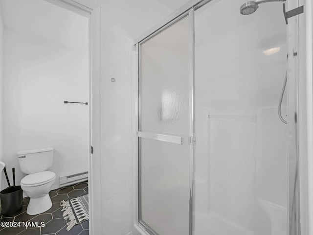 bathroom featuring a baseboard heating unit, tile patterned flooring, a shower stall, and toilet