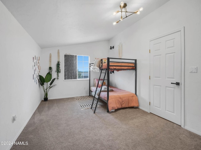 bedroom with lofted ceiling, carpet, and baseboards