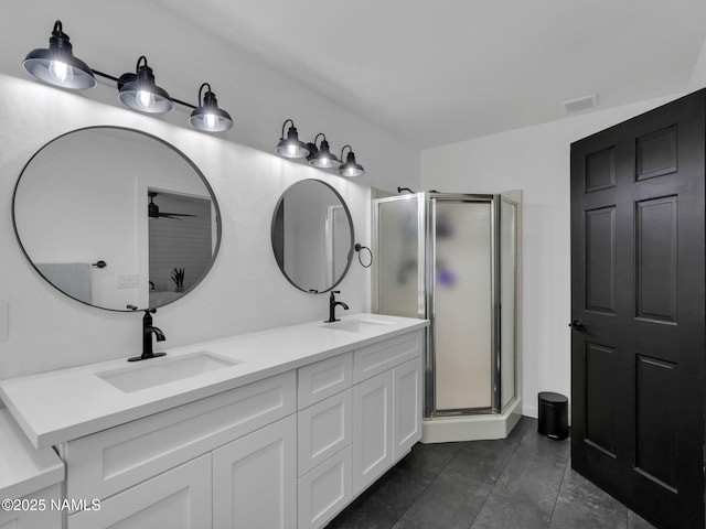 389 N Laramy Ln, Parks, AZ 86018 - bathroom featuring a stall shower, double vanity, ceiling fan, and tile patterned flooring