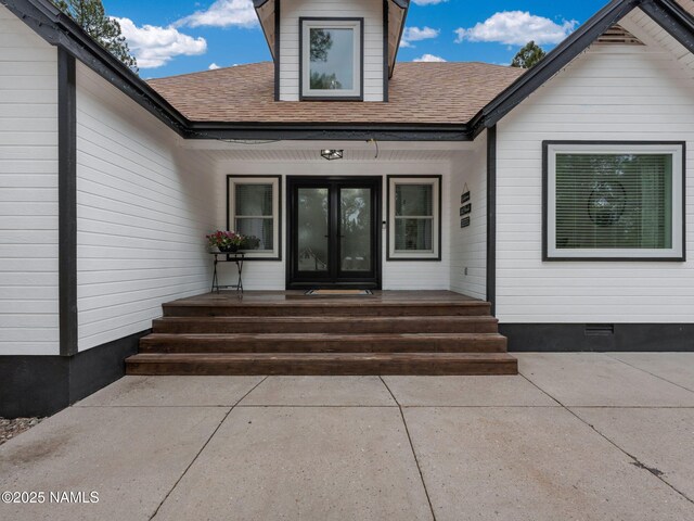 389 N Laramy Ln, Parks, AZ 86018 - doorway to property with roof with shingles, crawl space, and covered porch