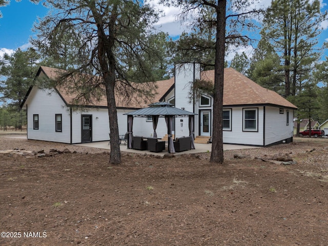 389 N Laramy Ln, Parks, AZ 86018 - rear view of property with an outdoor living space, a patio, a chimney, a gazebo, and roof with shingles
