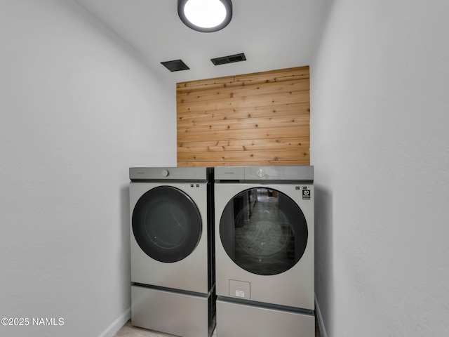 389 N Laramy Ln, Parks, AZ 86018 - clothes washing area featuring washing machine and clothes dryer and baseboards