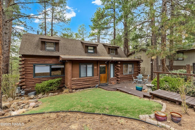 2856 Chaco Trl, Flagstaff, AZ 86005 - view of front of home with a shingled roof, a wooden deck, and log siding