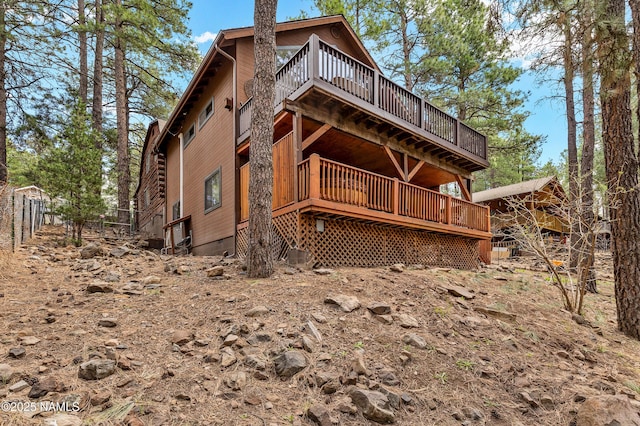 rear view of property with a deck