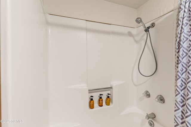 full bathroom featuring shower / bath combo with shower curtain