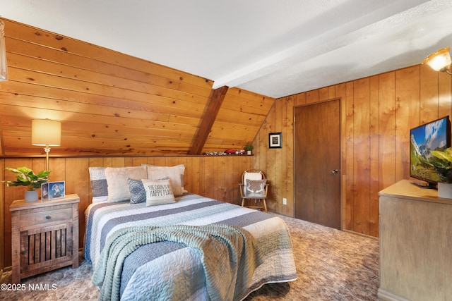 carpeted bedroom with vaulted ceiling with beams and wood walls