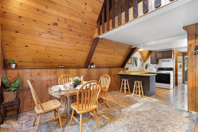 dining area featuring wood ceiling, wood walls, and vaulted ceiling with beams