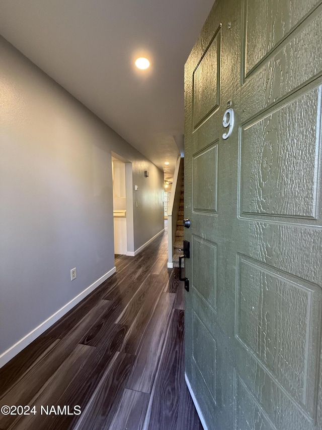 hallway featuring dark wood-type flooring