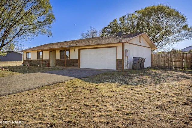 11280 N Zady Ln, Flagstaff, AZ 86004 - ranch-style home featuring fence, aphalt driveway, and a garage
