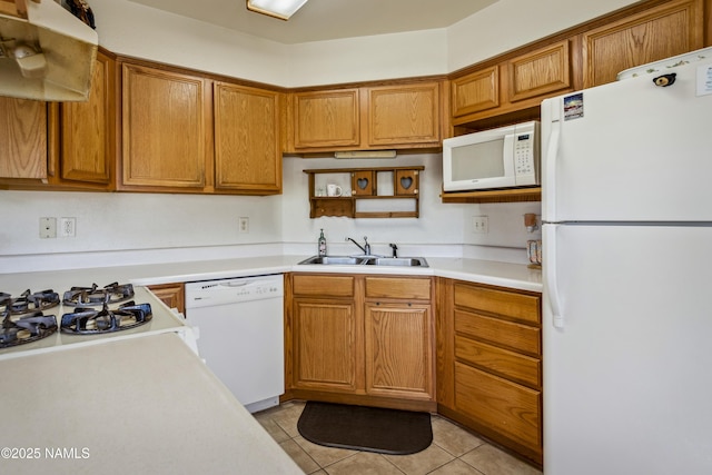 11280 N Zady Ln, Flagstaff, AZ 86004 - kitchen with a sink, light tile patterned flooring, white appliances, brown cabinetry, and light countertops